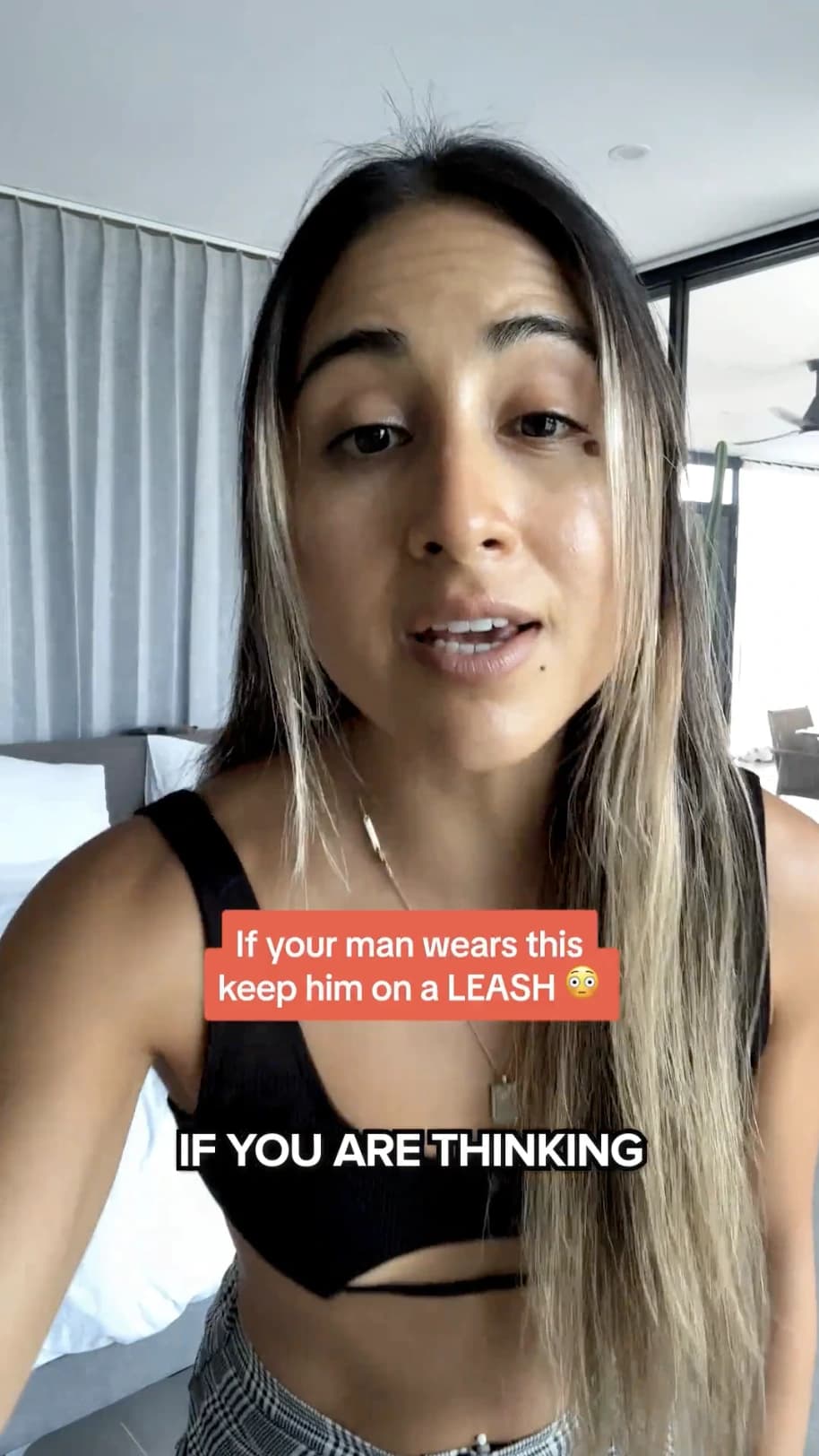 UGC creator talking to camera in her bedroom, with a text hook on screen